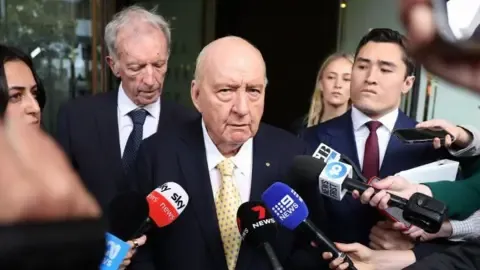 Sex Abuse Allegations Against Top Australian Media Personality Reduced